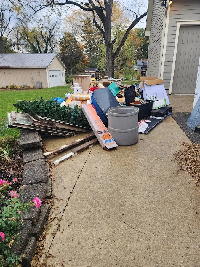 Dumpster being loaded with debris for Demolition Dumpster Rental in Streamwood